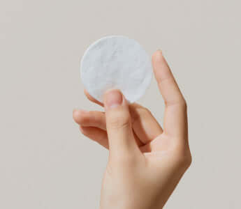 cotton pad held in hand